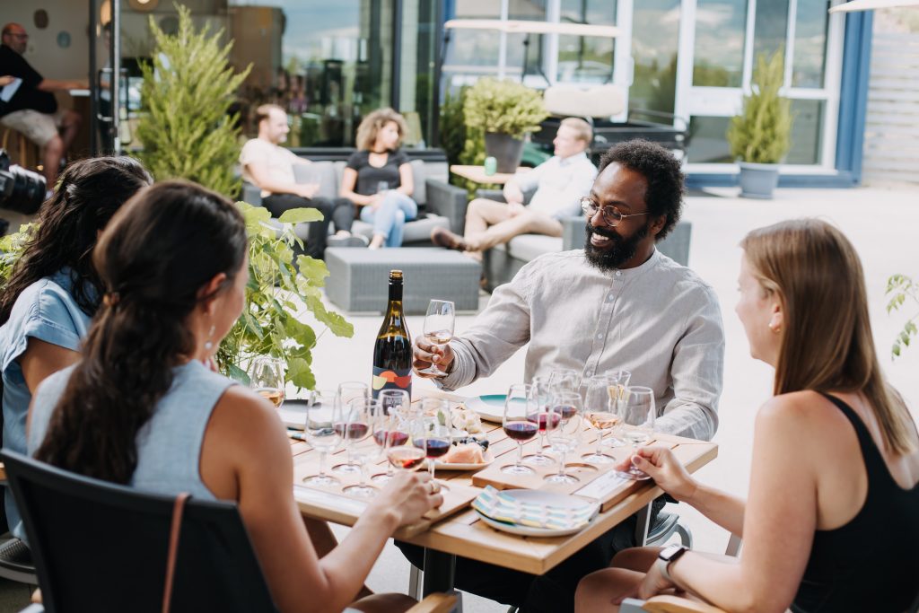 wine lovers enjoying wine on the patio of haywire winery